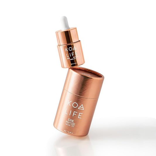 KOA Life GHK Peptide Daily Ultra-Hydrating, Anti-Aging Facial Oil. In a metallic copper glass dropper bottle and metallic copper outer cylinder carton